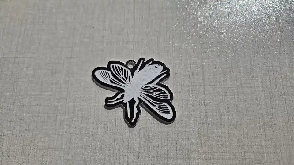 Bee keychain engraved white on dark brown two-tone acrylic and cut to shape