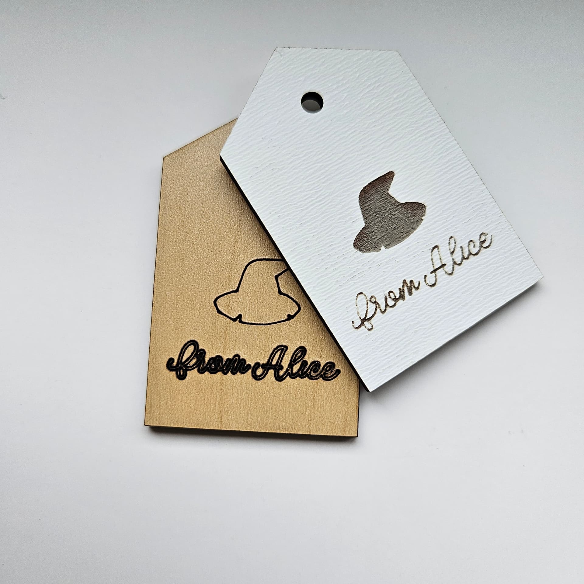 Laser-cut gift tag in a traditional tag shape, crafted from durable plywood.